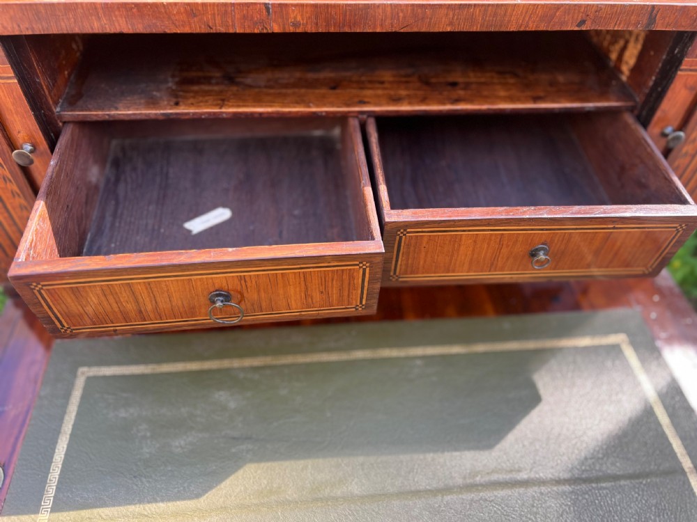 An 18th-century French bonheur de jour desk in warm brown inlaid wood, featuring square tapered legs, a single drawer with a tassel key, and a top cabinet with a pierced brass gallery. View X