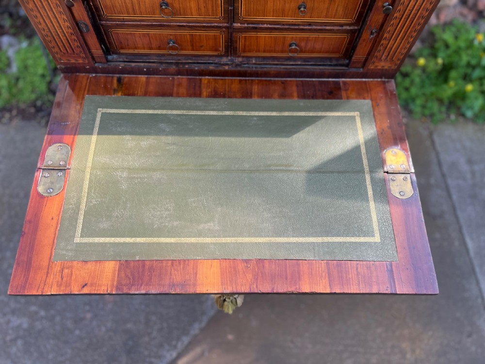 An 18th-century French bonheur de jour desk in warm brown inlaid wood, featuring square tapered legs, a single drawer with a tassel key, and a top cabinet with a pierced brass gallery. View XI