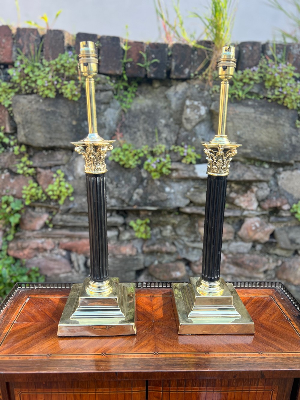 Near pair of Corinthian wooden and brass table lamps  View III