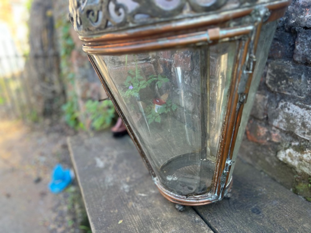 A large Edwardian copper and glass hanging lantern featuring decorative cresting and a top suspension loop. View VI