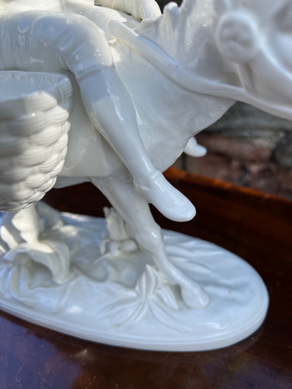 Pair of porcelain figures by moore bros, depicting a man and a woman riding donkeys  View III
