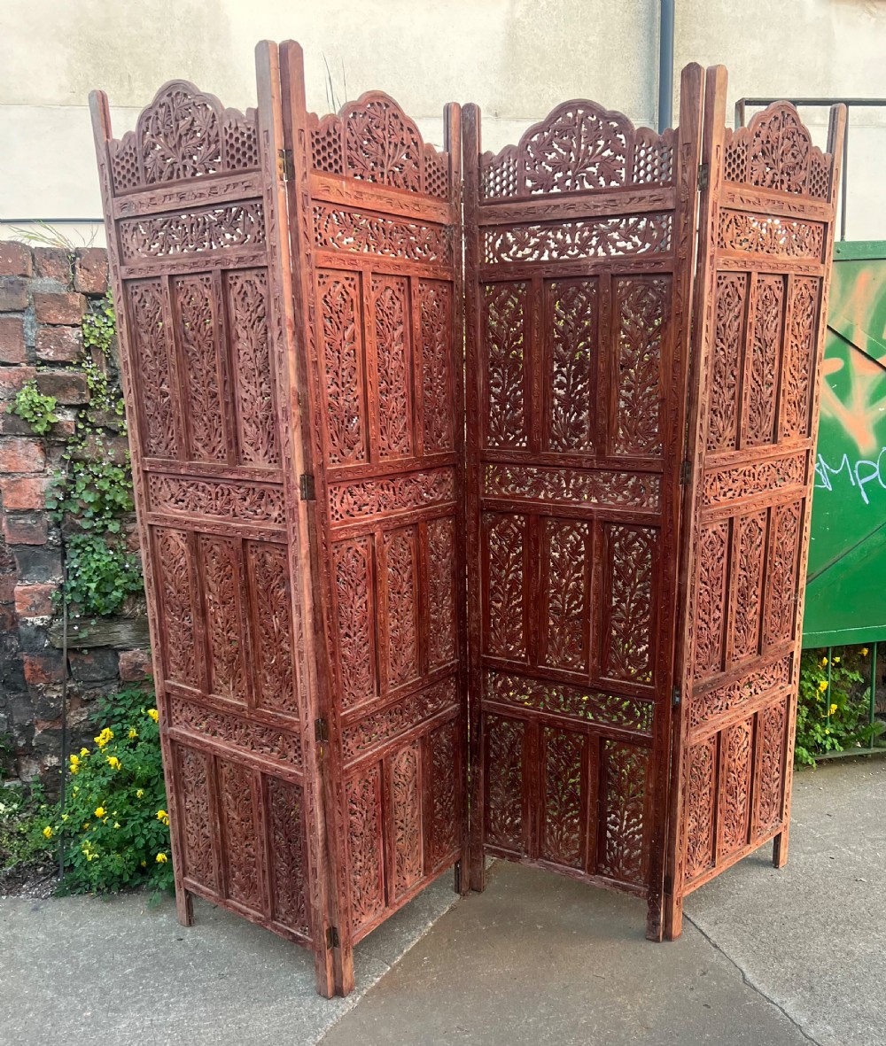 Carved wooden four fold screen