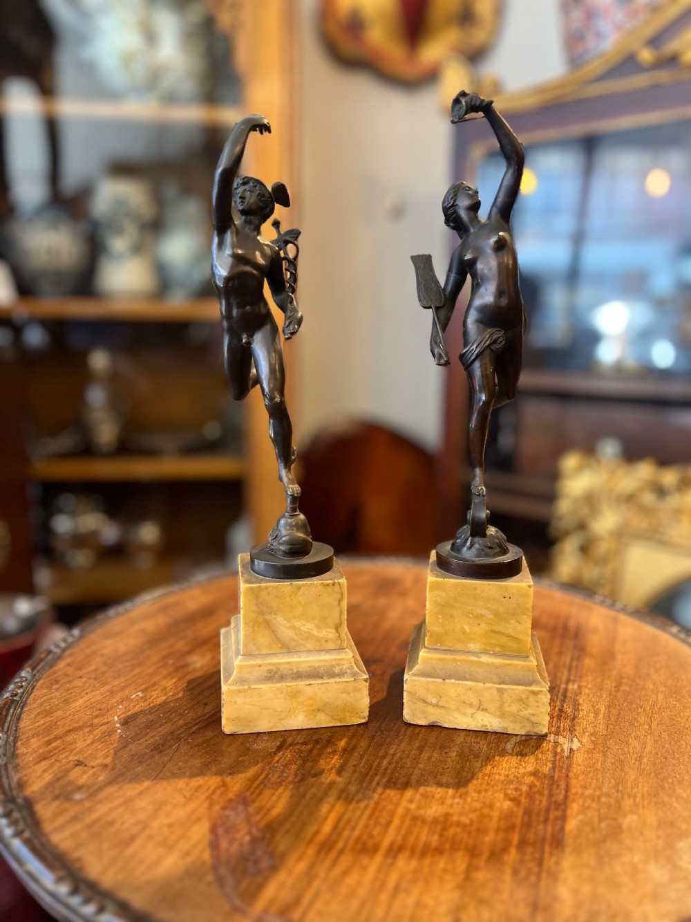 Antique bronze pair of fortuna and mercury on sienna marble bases 