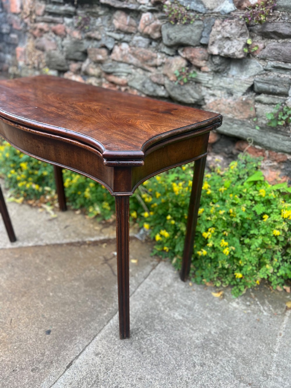 George III serpentine fronted mahogany tea table  View II