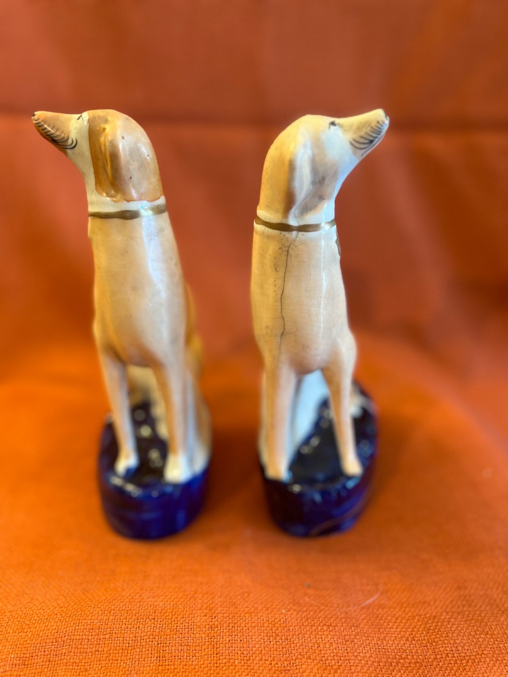 A pair of Staffordshire pottery greyhounds  View V