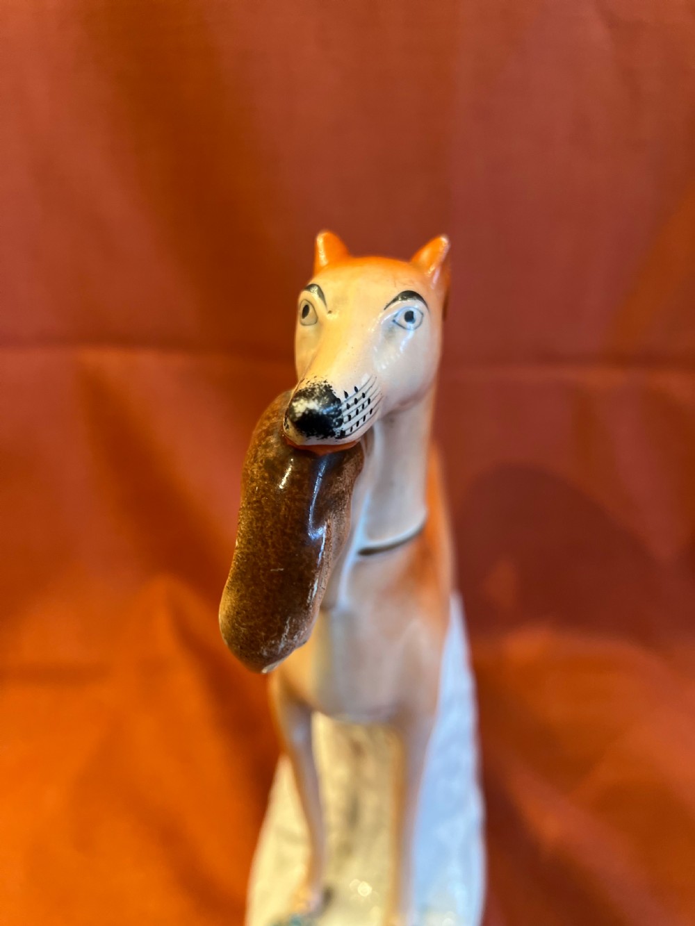 Pair of large Staffordshire greyhounds with hares in their  mouths  View V
