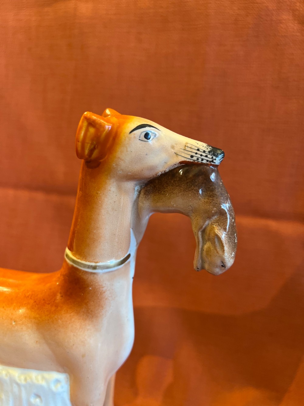 Pair of large Staffordshire greyhounds with hares in their  mouths  View XIII