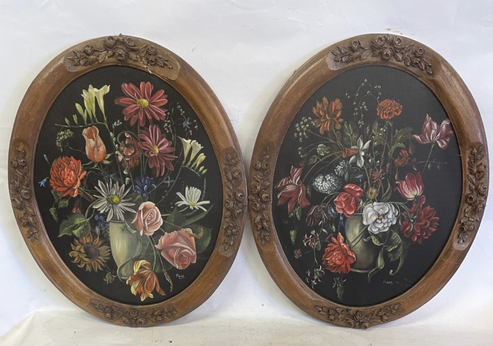 A pair of oil paintings of still life’s on board in a wood and gesso oval frame 