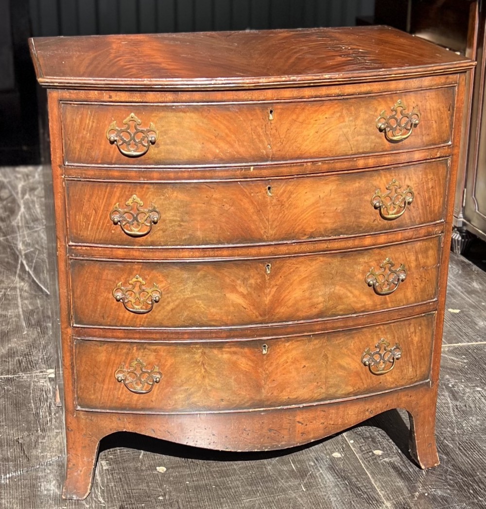 Small Bow front flame mahogany chest of drawers 