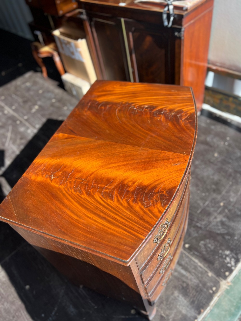 Small Bow front flame mahogany chest of drawers  View III