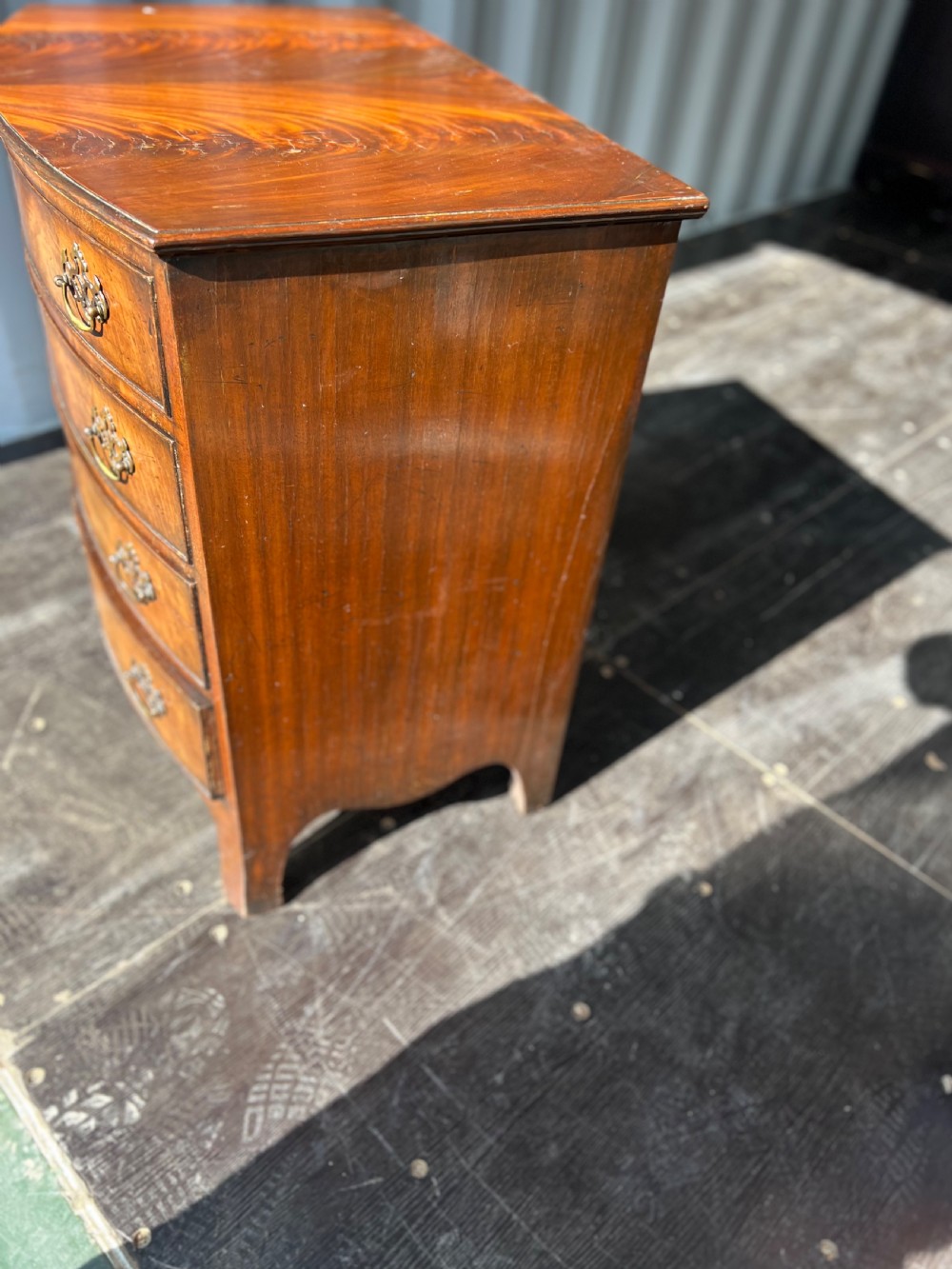 Small Bow front flame mahogany chest of drawers  View V