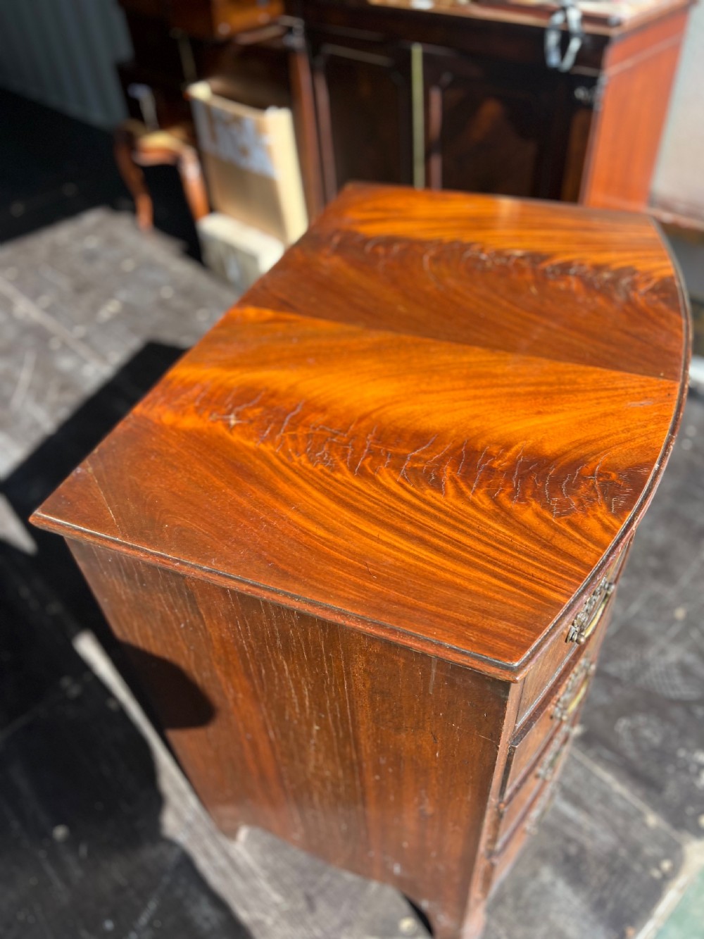 Small Bow front flame mahogany chest of drawers  View VII