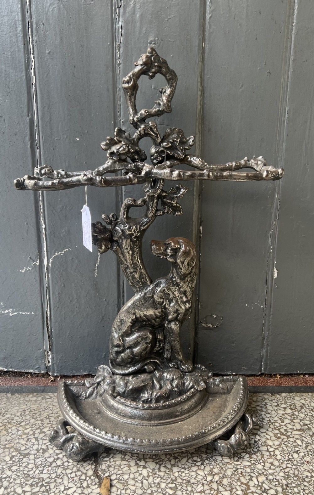 Antique cast iron stick stand with sitting dog 