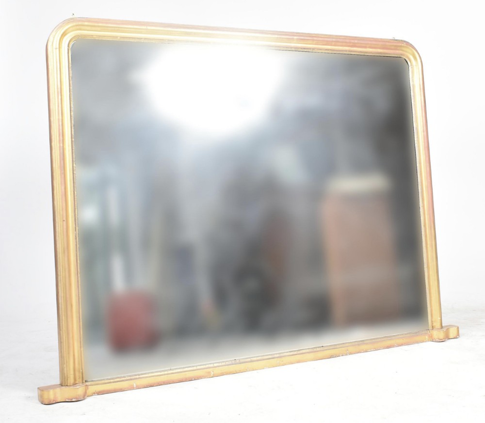 A large giltwood overmantel mirror 