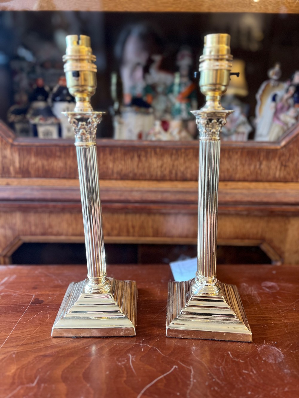 Pair of small brass Corinthian lamps  View II