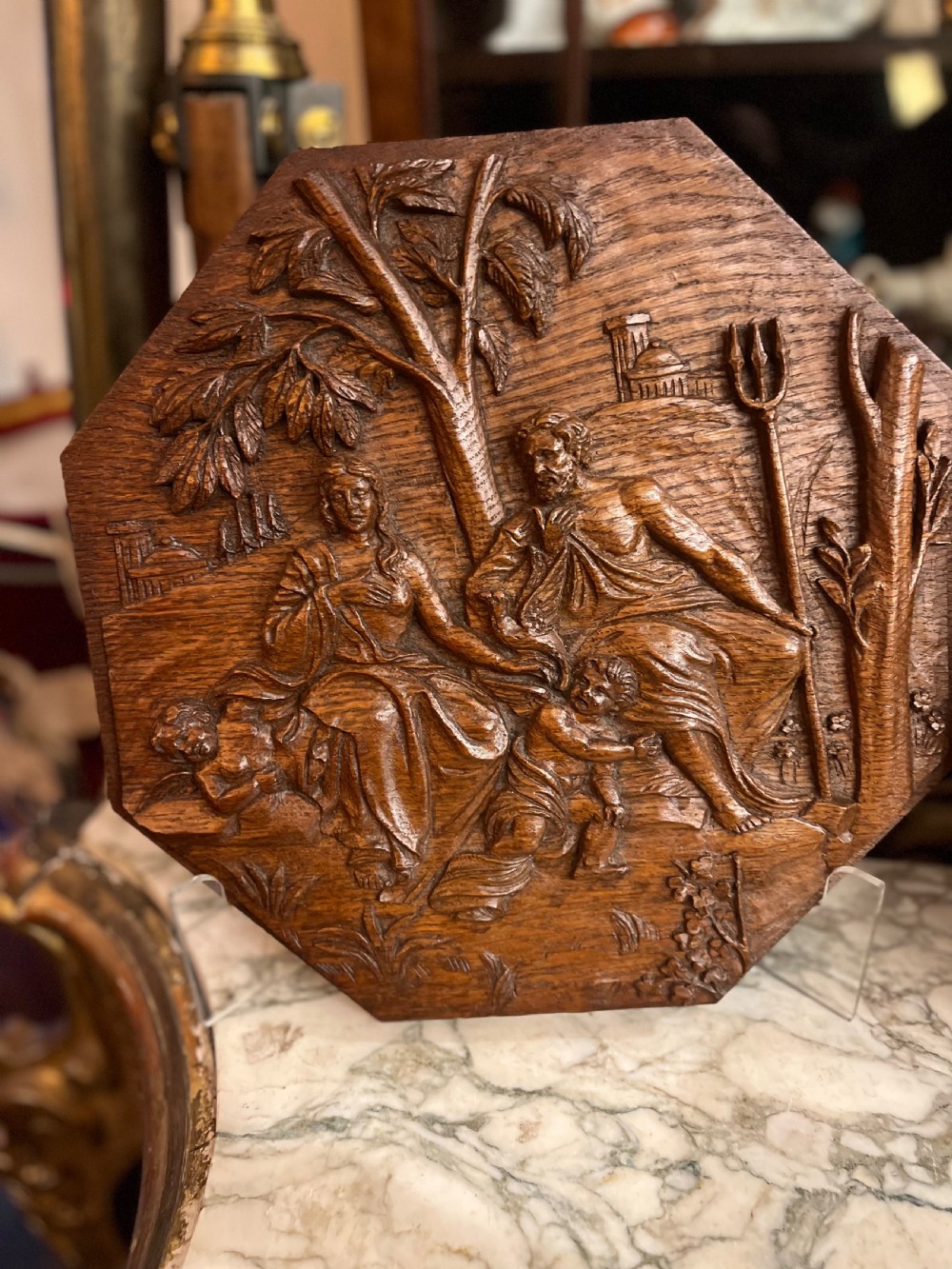 A pair of octagonal 18th-century carved oak relief plaques featuring classical mythological figures. View II