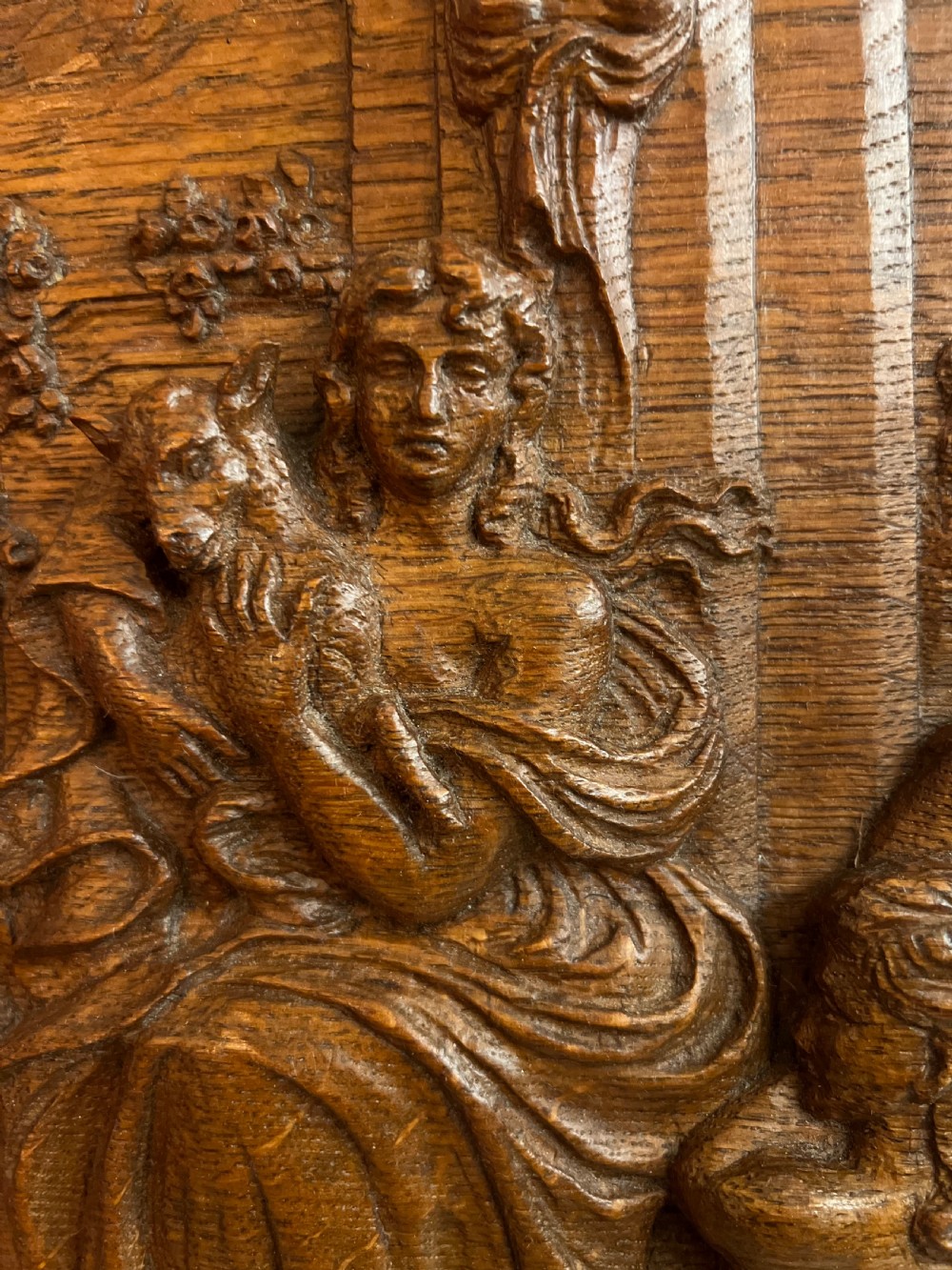 A pair of octagonal 18th-century carved oak relief plaques featuring classical mythological figures. View VIII