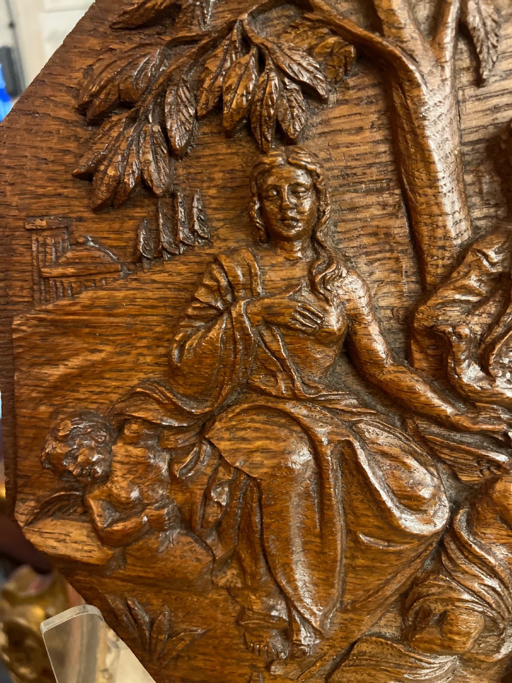 A pair of octagonal 18th-century carved oak relief plaques featuring classical mythological figures. View IX