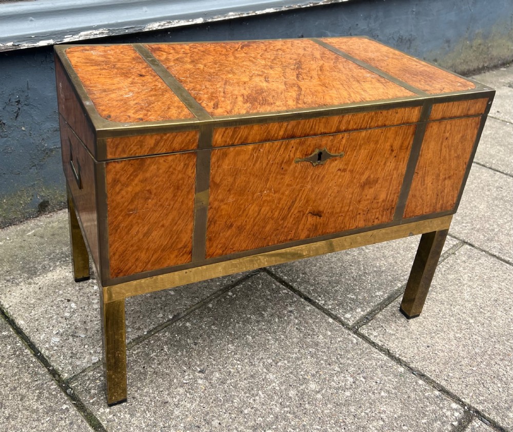 C19th amboyna veneered campaign writing slope on stand 