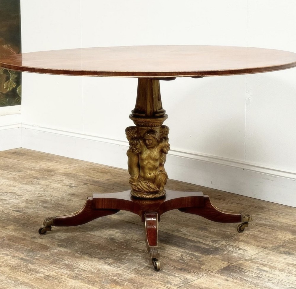 Large carved base marquetry topped round table 