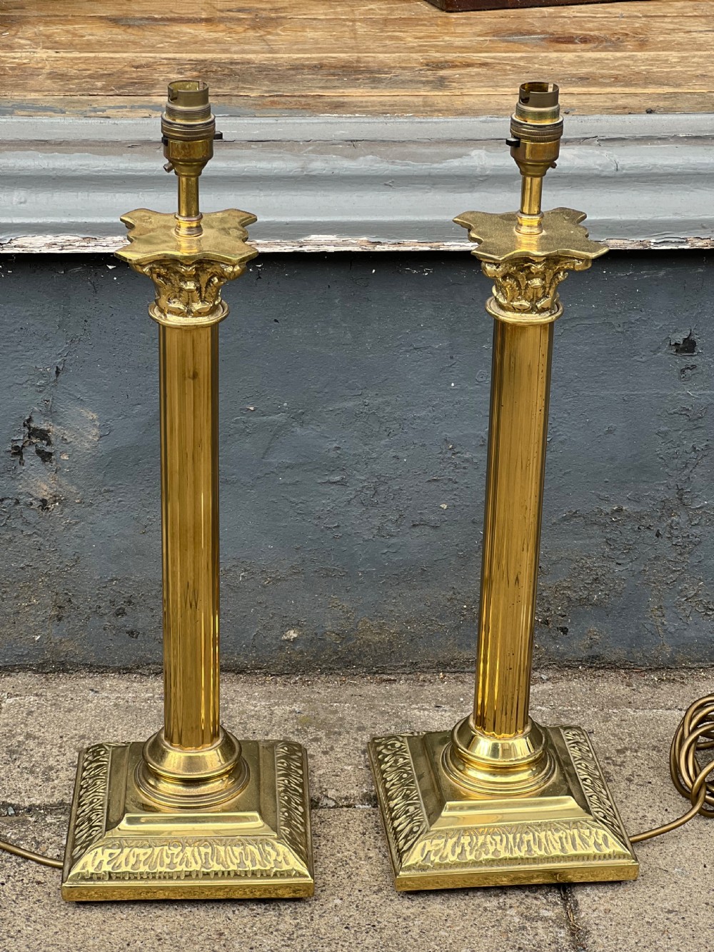 Pair of brass corinthian column table lamps 