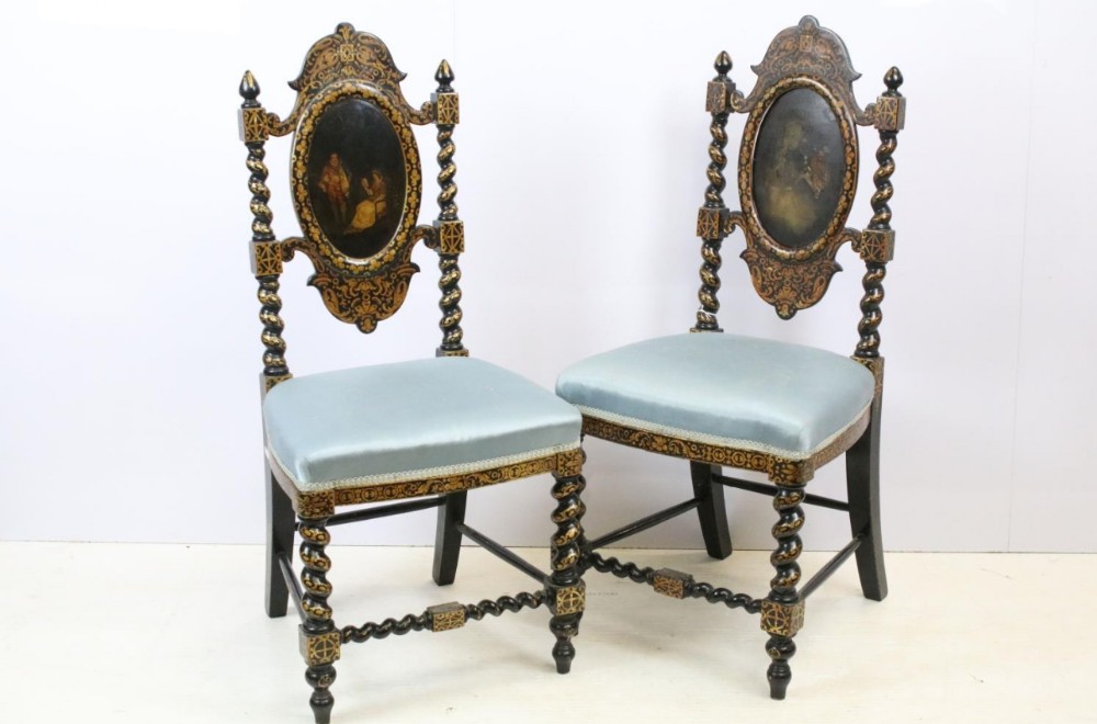 Pair of papier mache hall chairs with gilt and painted decoration in the manner of Jennens and betteridge