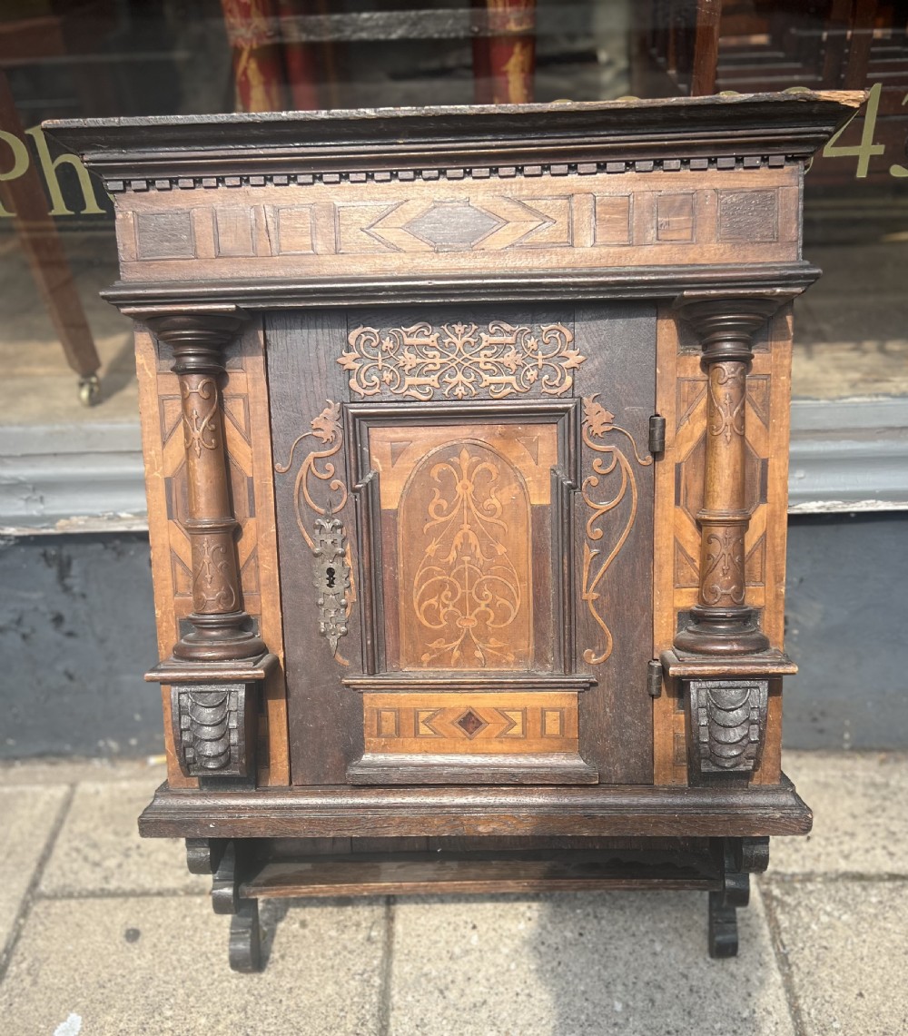 An C18th German marquetry wall cupboard in walnut walnut 