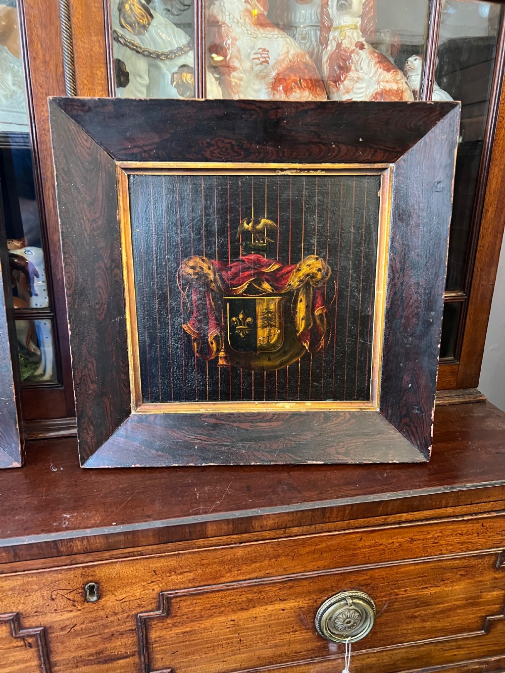 Georgian crested segment from carriage in faux rosewood frame 