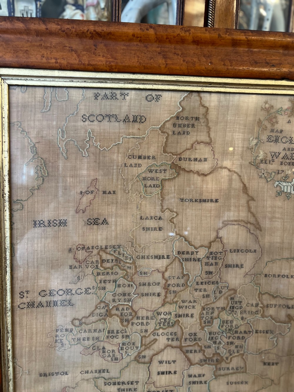 C18th sampler of England and Wales on a burr maple frame  View III