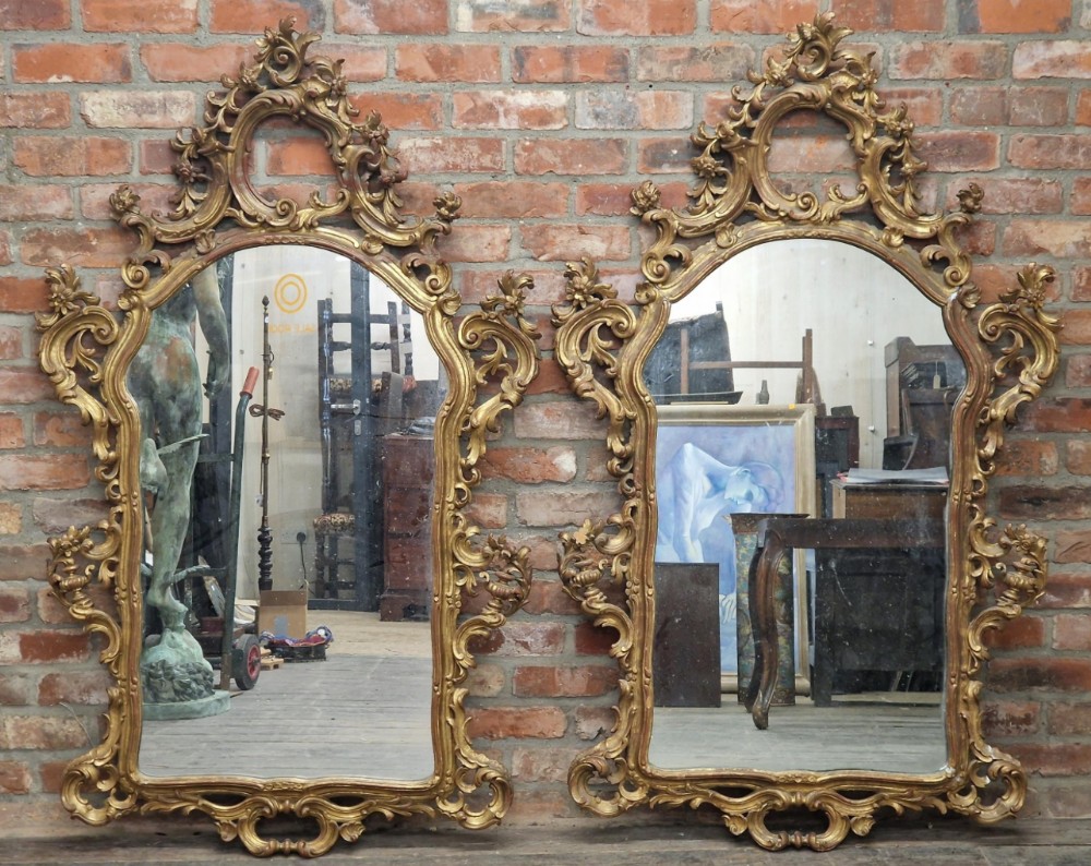 Large pair of carved giltwood wall mirrors  