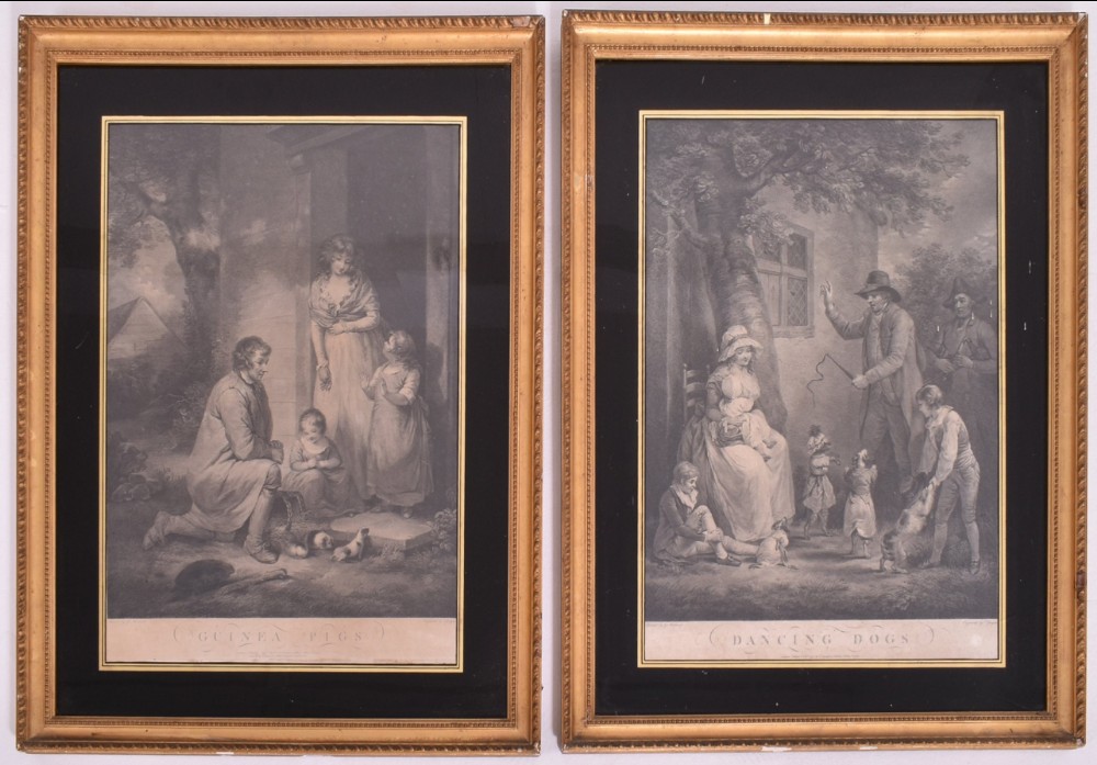 A pair of eighteenth-century framed monochrome engravings depicting rural genre scenes within carved gilt wooden frames with black glass mounts.
