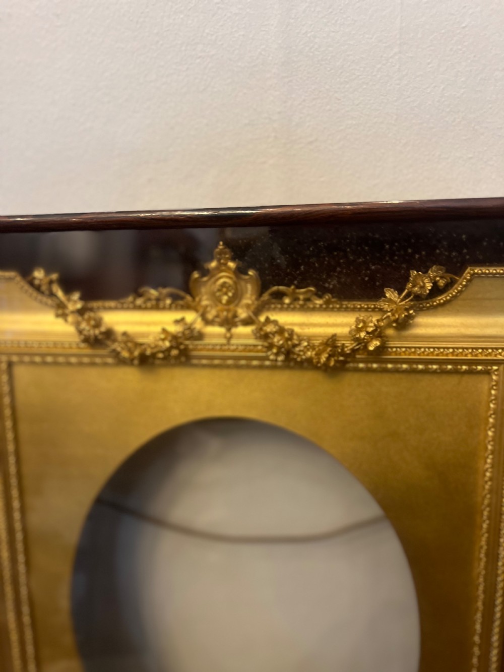 C19th gilt frame in glass case  View II