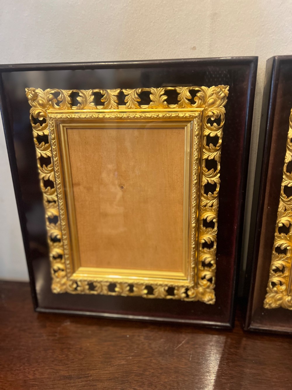 Pair of C9th gilt picture frames in glass case  View II