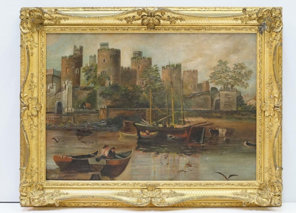 C19th oil painting on board showing a coastal scene with castle and boats 