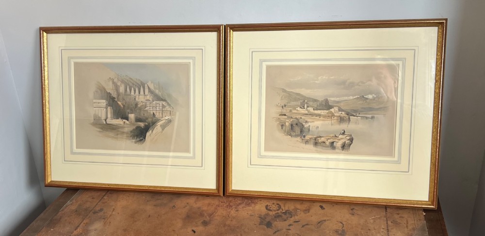 A pair of nineteenth-century tinted topographical prints depicting Middle Eastern architectural landscapes, displayed in gilt wood frames with multi-line cream mounts. View VI