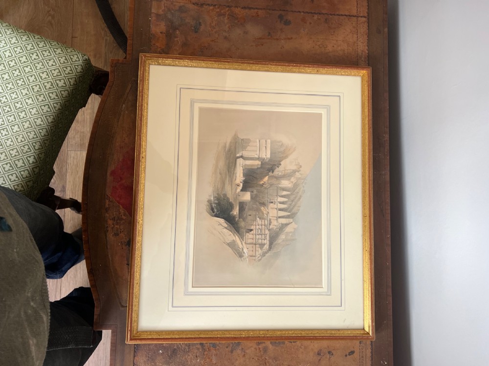 A pair of nineteenth-century tinted topographical prints depicting Middle Eastern architectural landscapes, displayed in gilt wood frames with multi-line cream mounts. View VII