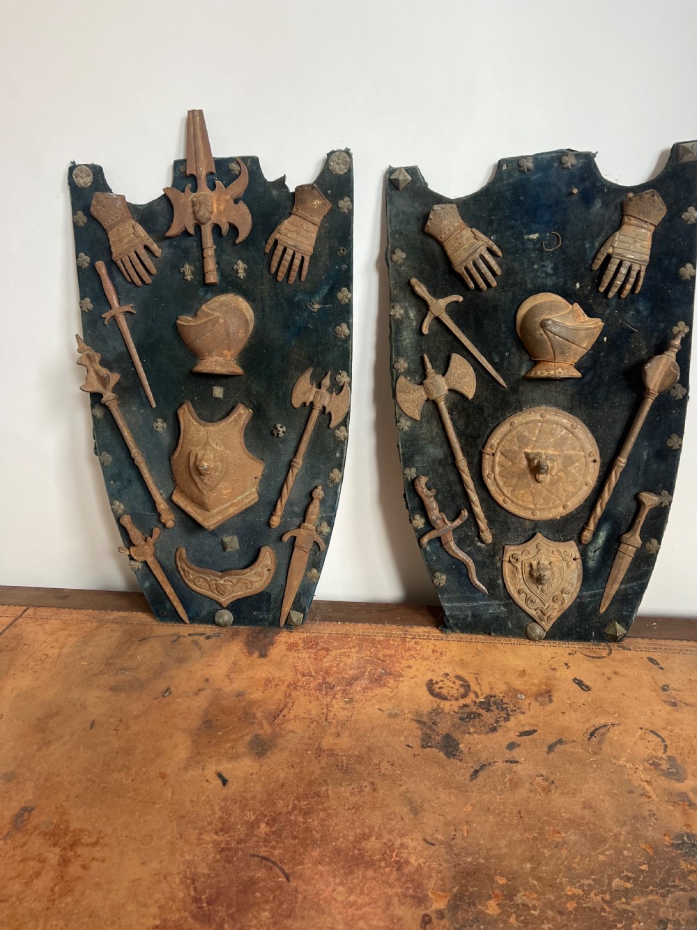 C19th display of miniature weapons in cast iron mounted on a velvet covered board  View II