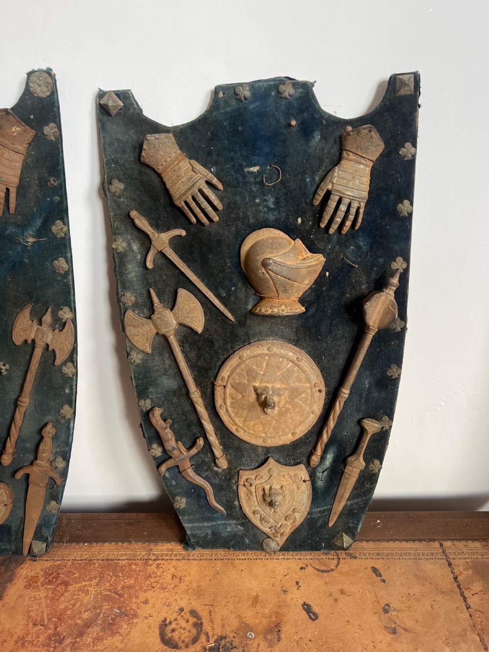 C19th display of miniature weapons in cast iron mounted on a velvet covered board  View III