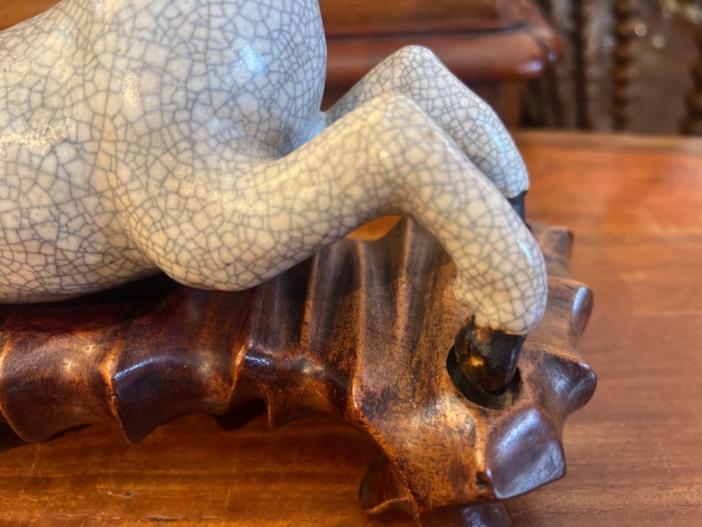 Japanese crackleglazed ceramic horse on carved wooden stand View V