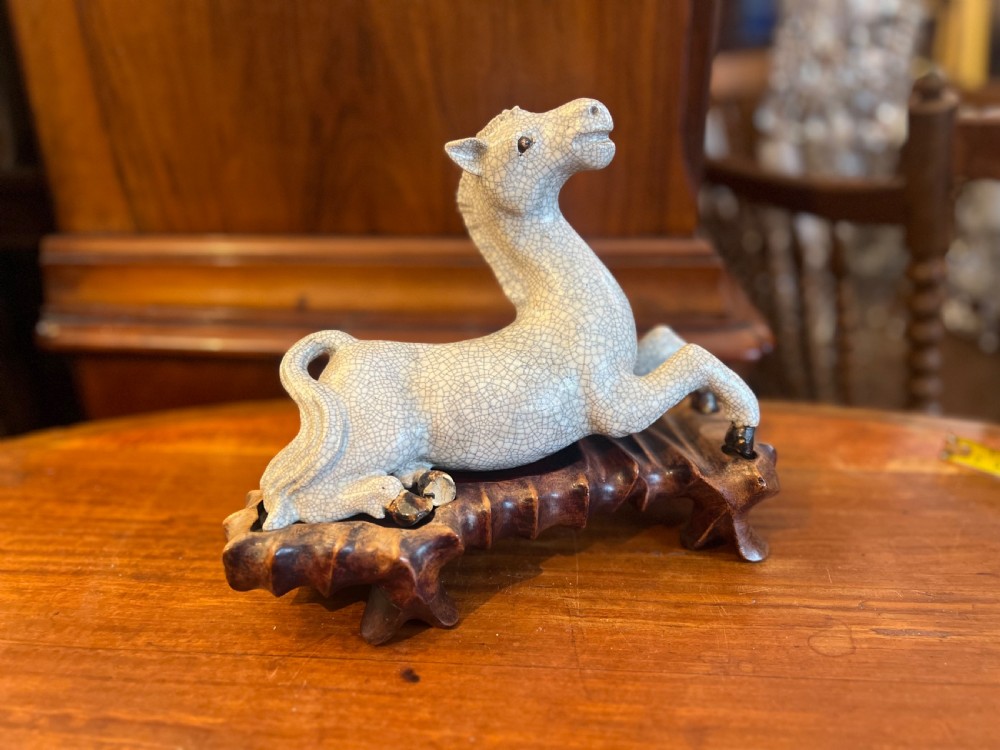 Japanese crackleglazed ceramic horse on carved wooden stand View VIII