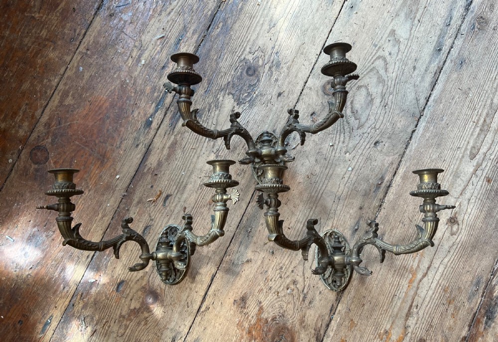 Set of three Edwardian twin armed wall sconces 