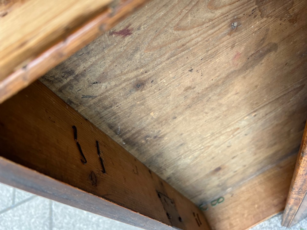 An early Georgian walnut side table with a single drawer, brass handles, shaped apron, and four cabriole legs. View XV