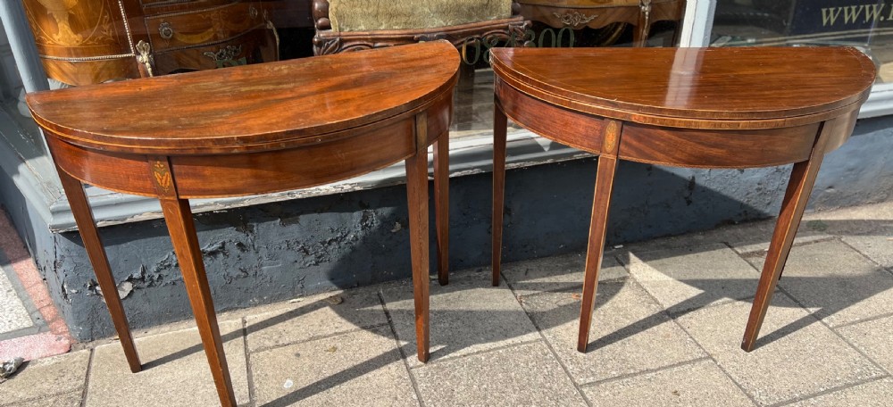 Near pair of Georgian Demi lune tables 