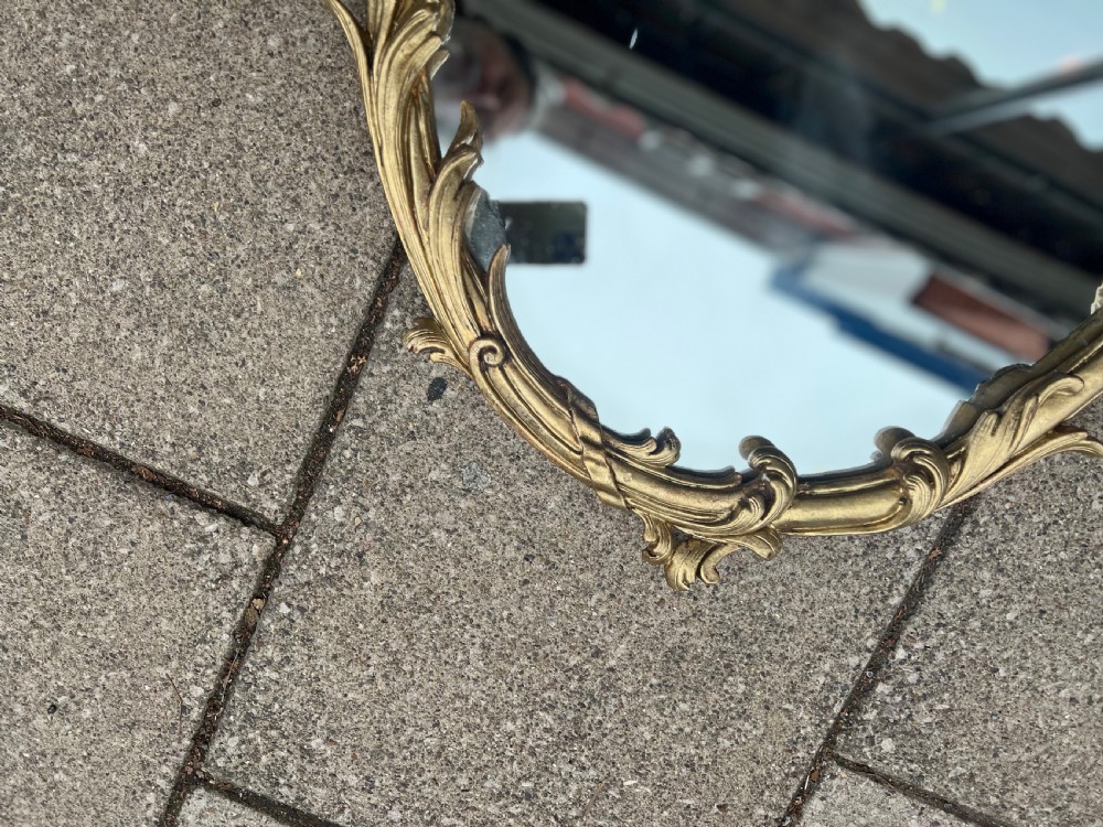 Pair of carved giltwood oval mirrors  View V
