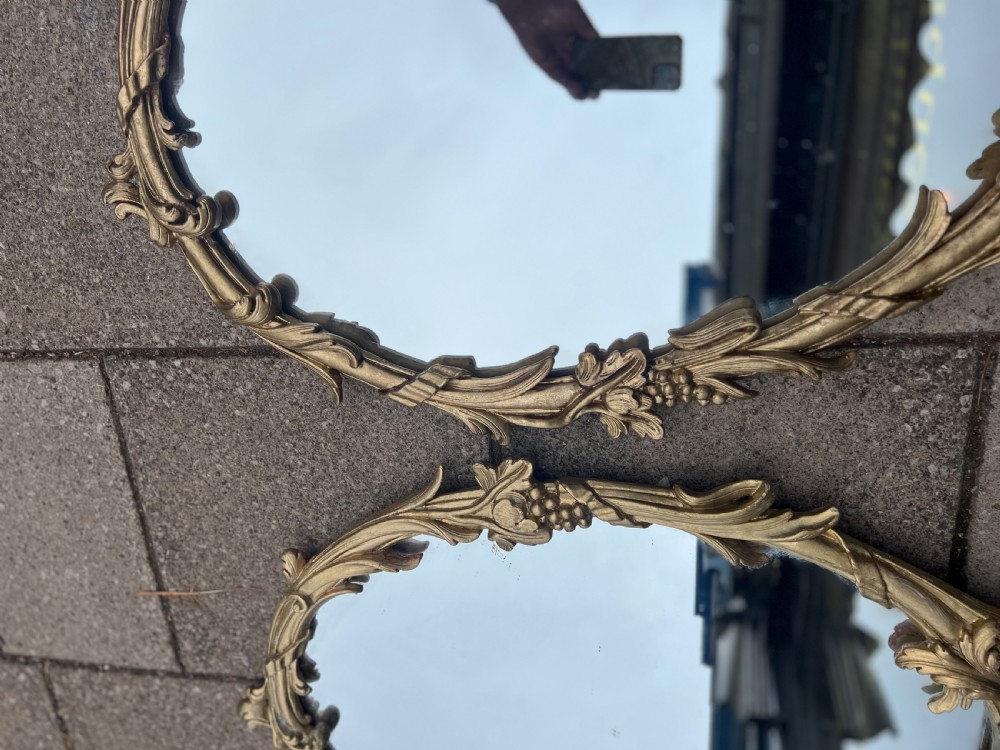 Pair of carved giltwood oval mirrors  View VIII