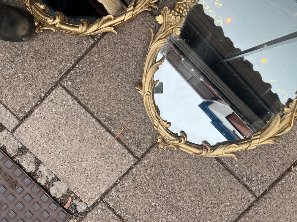 Pair of carved giltwood oval mirrors  View X