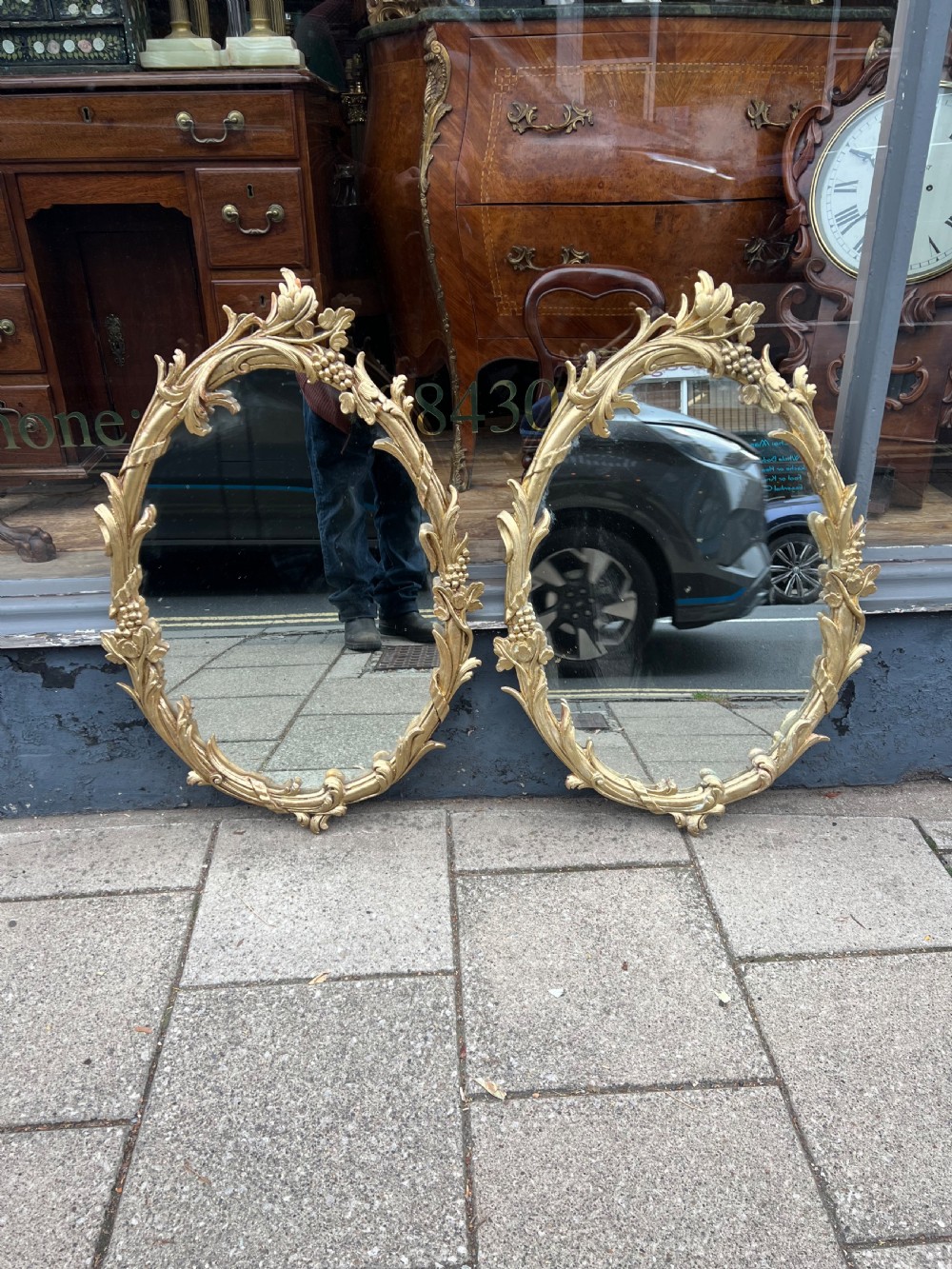 Pair of carved giltwood oval mirrors  View XII