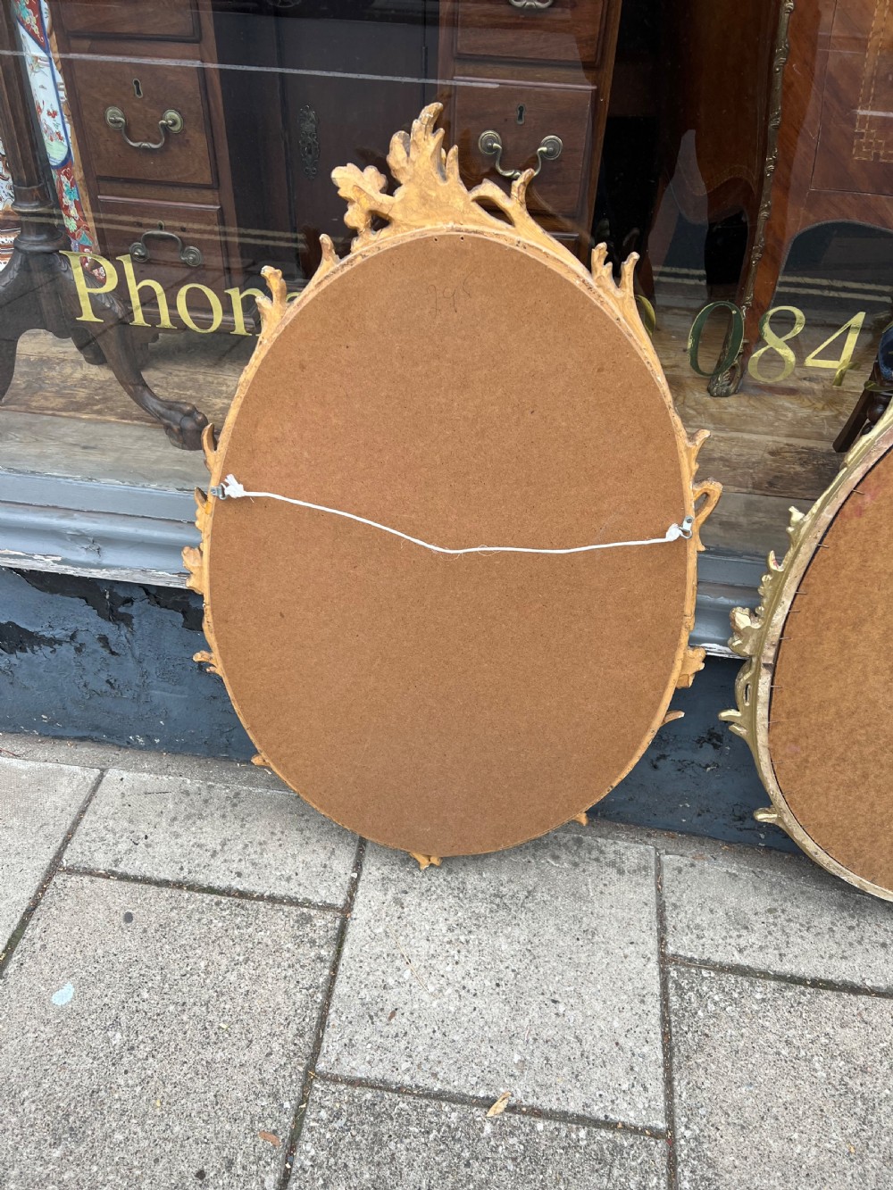 Pair of carved giltwood oval mirrors  View XV