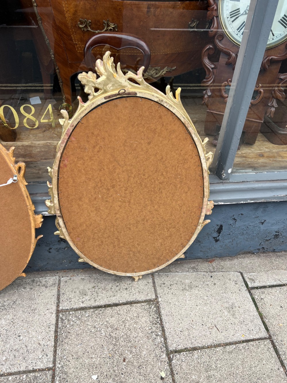 Pair of carved giltwood oval mirrors  View XVI
