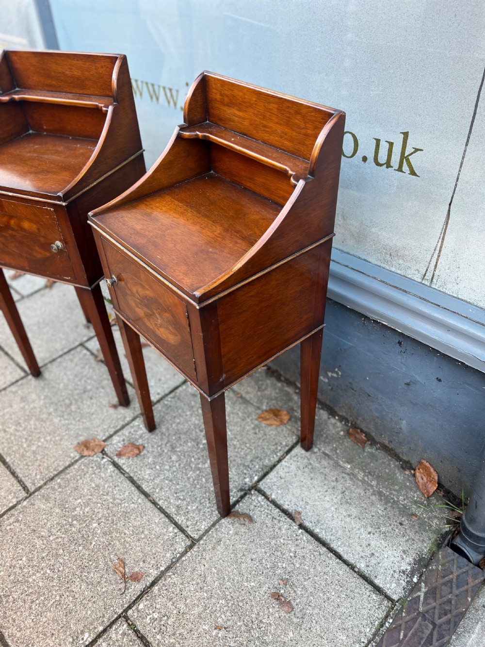 A pair of mahogany bedside cupboards  View III